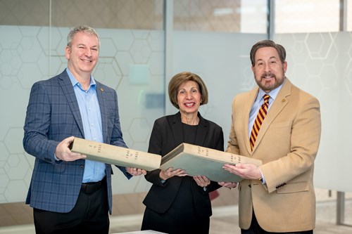 Provident Bank Members holding ledgers