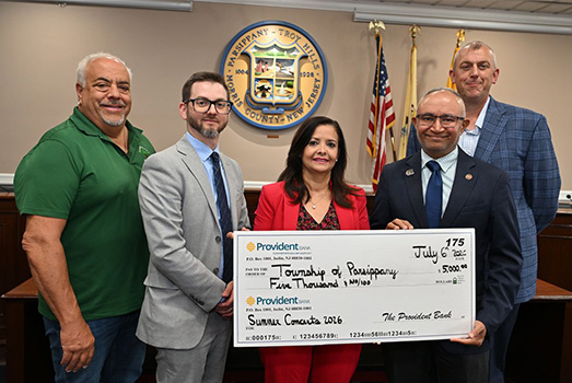 Group photo holding a large check sponsoring the Township of Parsippany